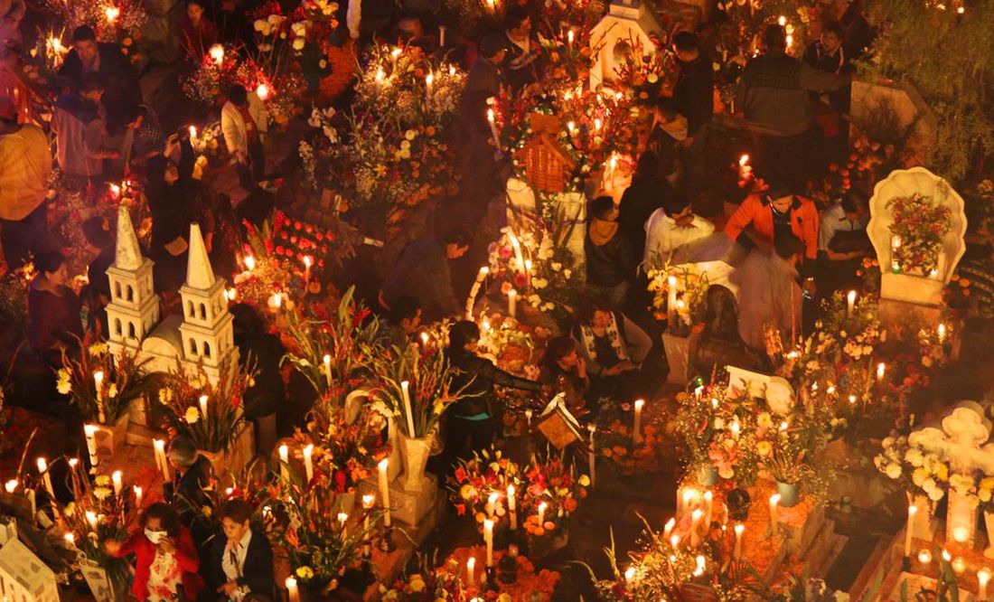 a group of people sitting at a table with many wine glasses