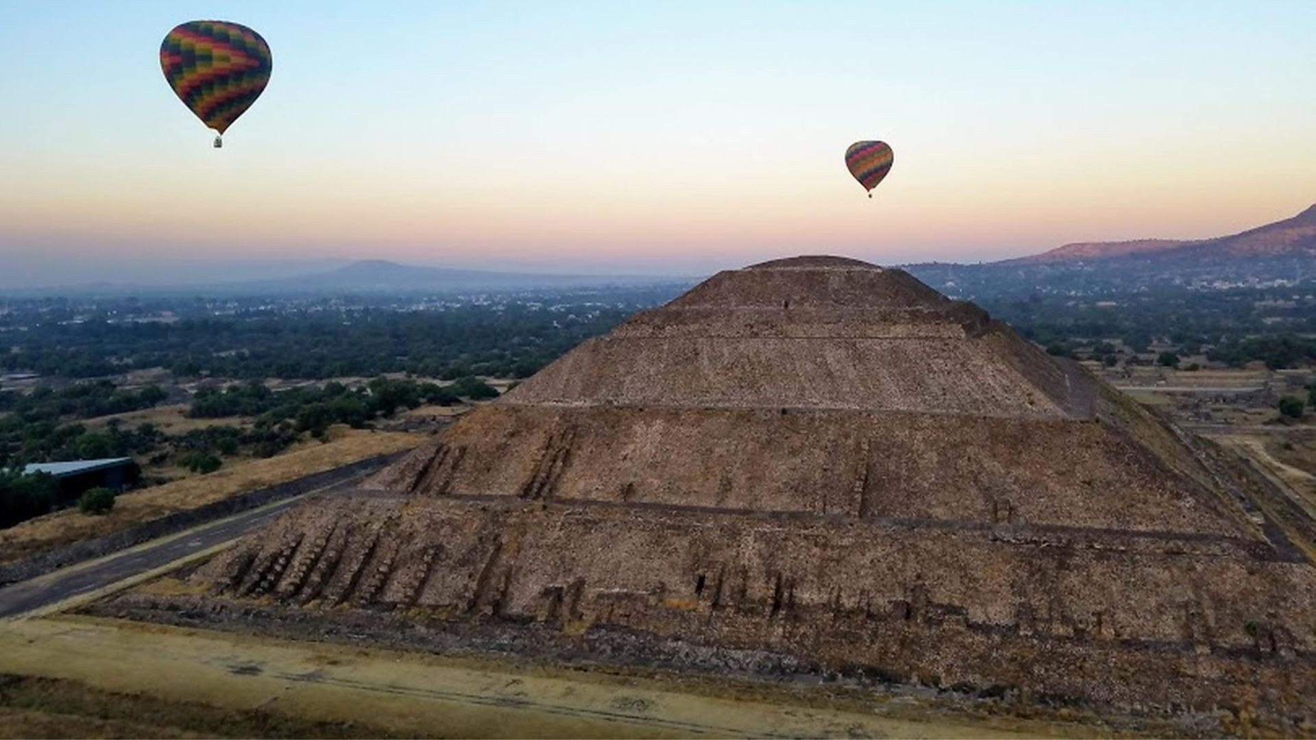 a balloon on the side of a mountain