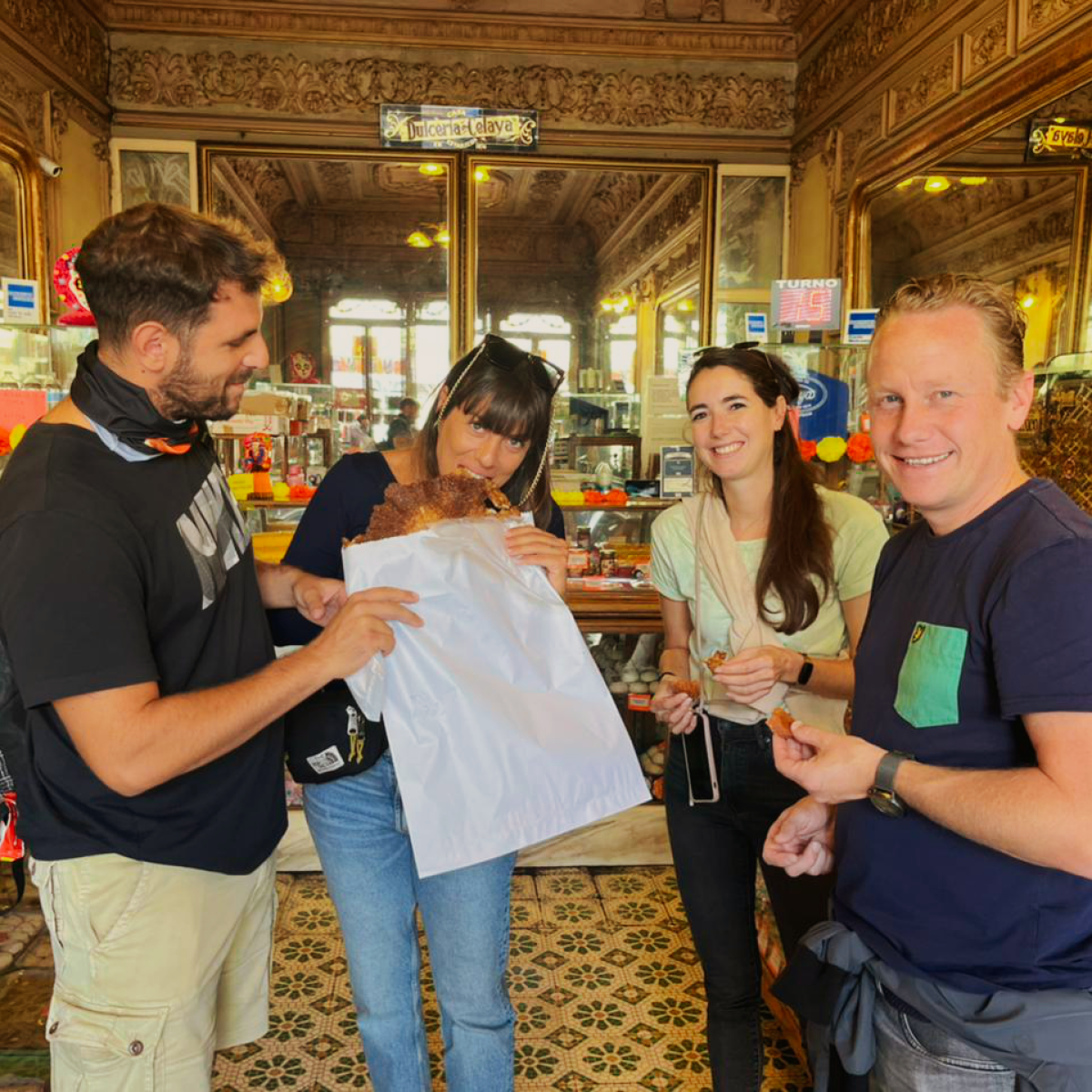 a group of people standing in front of a store