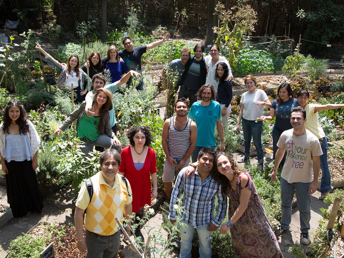 a group of people standing in front of a crowd posing for the camera